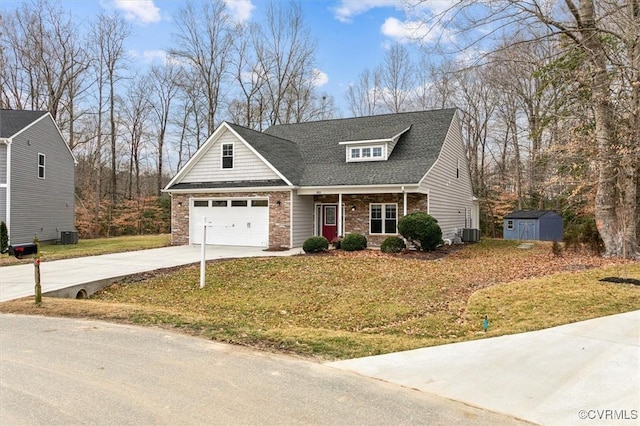 view of front of property featuring a garage, concrete driveway, a front lawn, and central AC