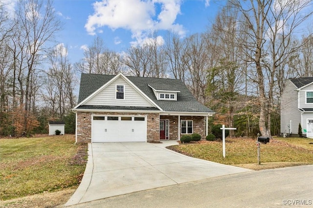 view of front of house featuring a shingled roof, concrete driveway, and a front lawn