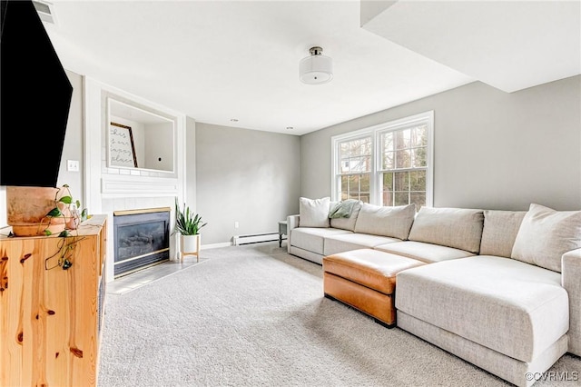 living room featuring a baseboard radiator, a tile fireplace, carpet flooring, visible vents, and baseboards