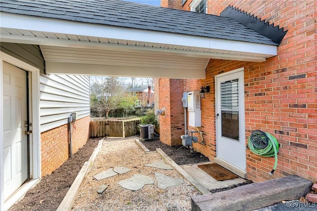 view of patio / terrace featuring cooling unit and fence