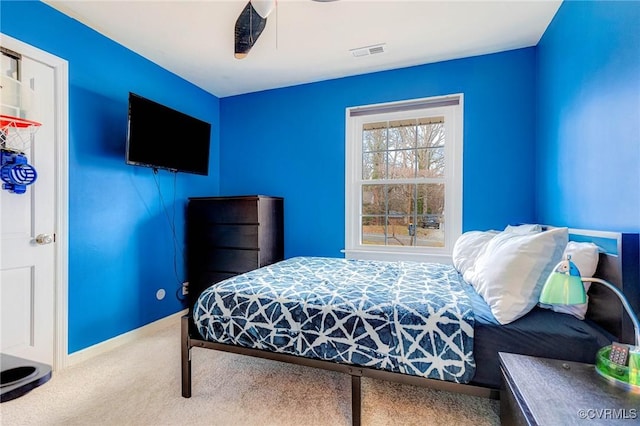 bedroom with carpet floors, visible vents, ceiling fan, and baseboards