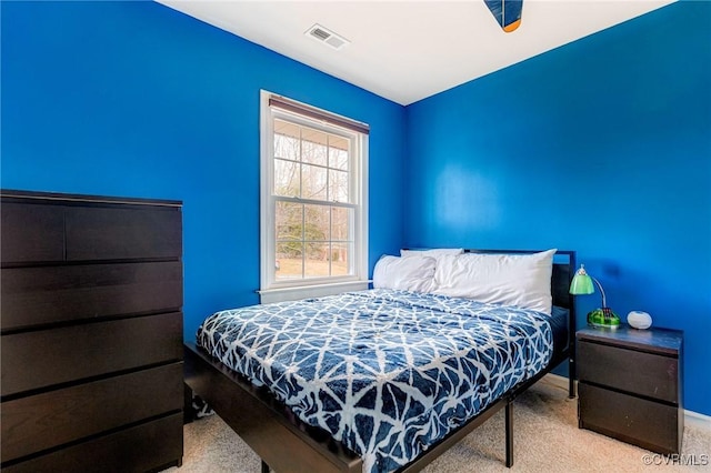 bedroom featuring carpet and visible vents