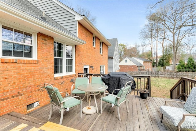 deck featuring visible vents, fence, area for grilling, and outdoor dining space