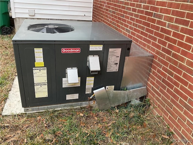 details featuring brick siding and cooling unit