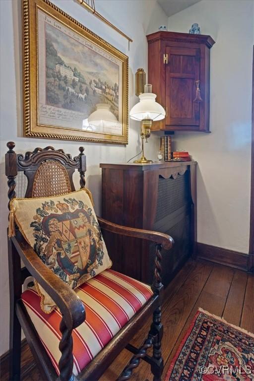 living area with hardwood / wood-style floors and baseboards