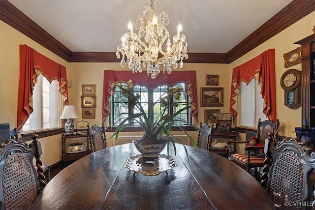 dining area featuring plenty of natural light, an inviting chandelier, and crown molding