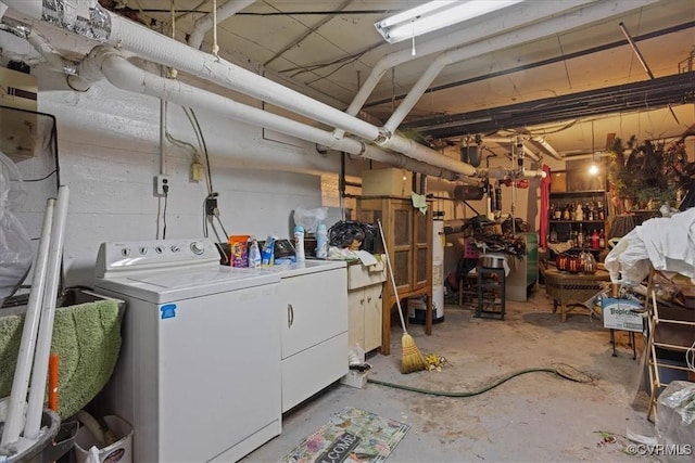 unfinished basement featuring washing machine and dryer