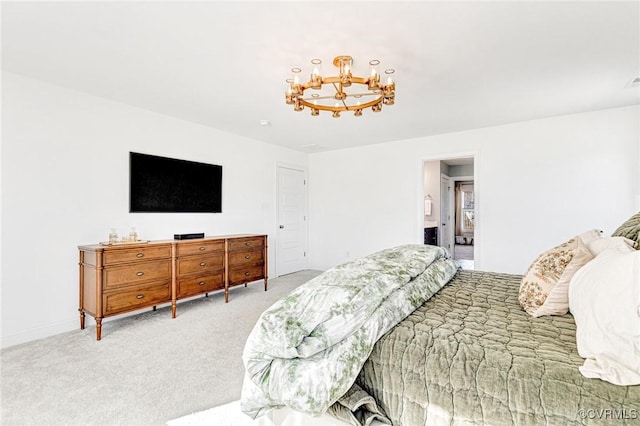 bedroom featuring a chandelier and light colored carpet