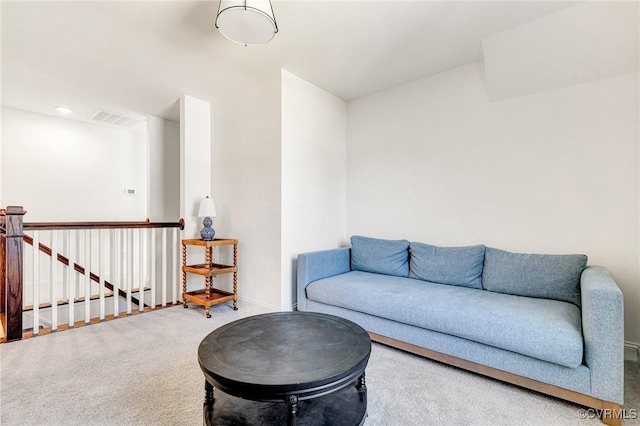 carpeted living room with baseboards, visible vents, and recessed lighting