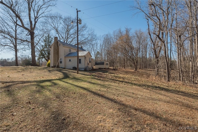1566 Ballsville Rd, Powhatan, VA 23139 - view of side of property featuring a chimney and a lawn