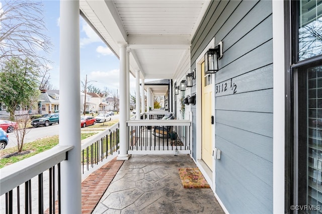 exterior space featuring a porch and a residential view