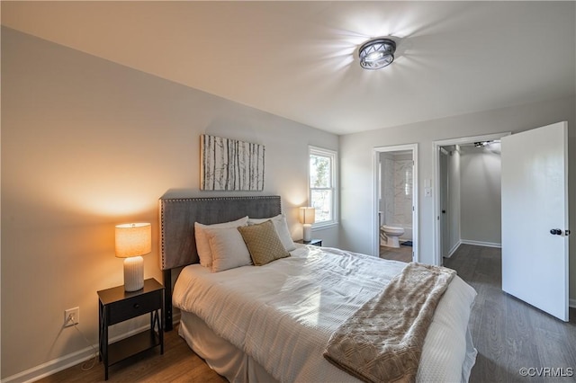 bedroom featuring ensuite bath, baseboards, and wood finished floors