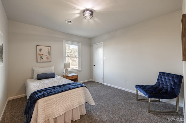 bedroom with baseboards, visible vents, and dark carpet