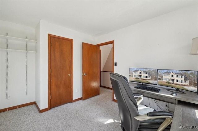 home office featuring carpet flooring and baseboards