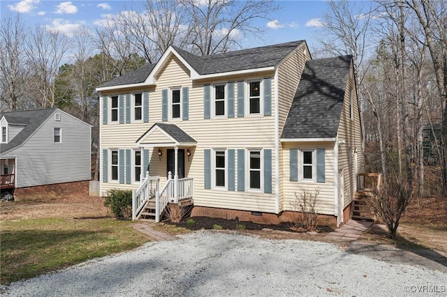 colonial house featuring crawl space and a shingled roof