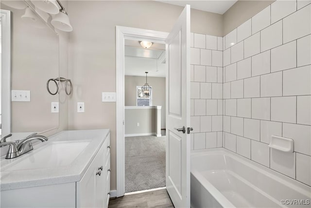 bathroom with tub / shower combination and vanity