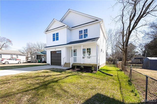 modern inspired farmhouse with driveway, a garage, a porch, fence, and a front lawn