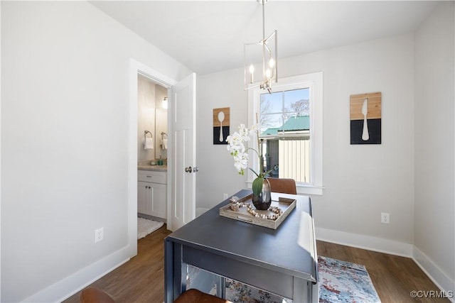 dining space with a notable chandelier, baseboards, and dark wood-style flooring