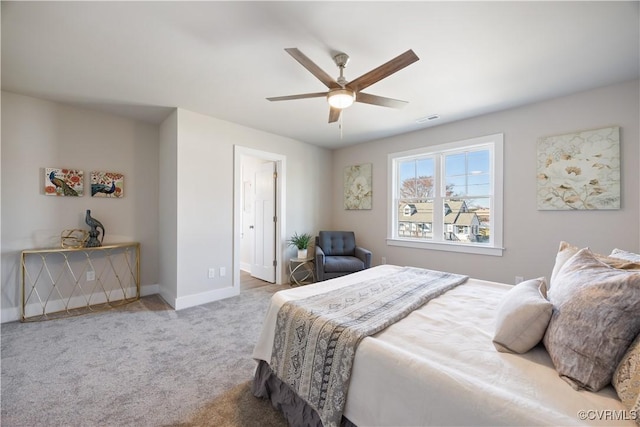 carpeted bedroom with baseboards, visible vents, and ceiling fan