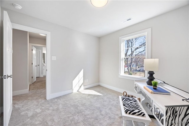 carpeted home office with baseboards and visible vents