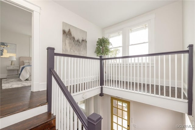 stairs featuring baseboards and wood finished floors