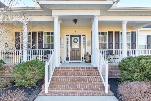 doorway to property with a porch