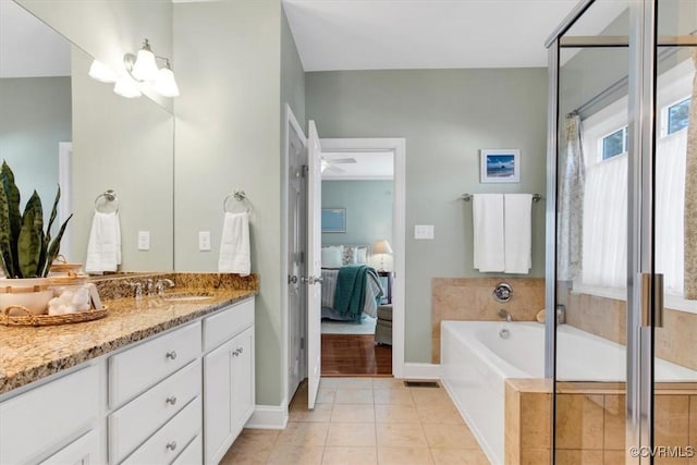 bathroom featuring a shower with door, ensuite bathroom, tile patterned flooring, vanity, and a bath