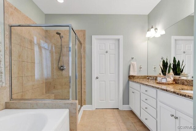 full bathroom featuring double vanity, tile patterned flooring, a bathtub, a shower stall, and a sink