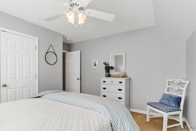 carpeted bedroom featuring ceiling fan and baseboards