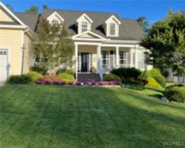 new england style home with a front yard