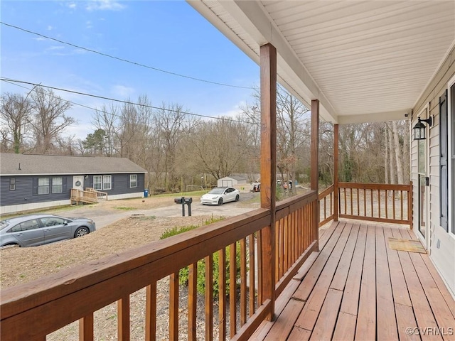 wooden terrace featuring a porch