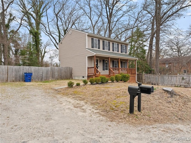 view of front of property featuring crawl space, driveway, fence, and a porch