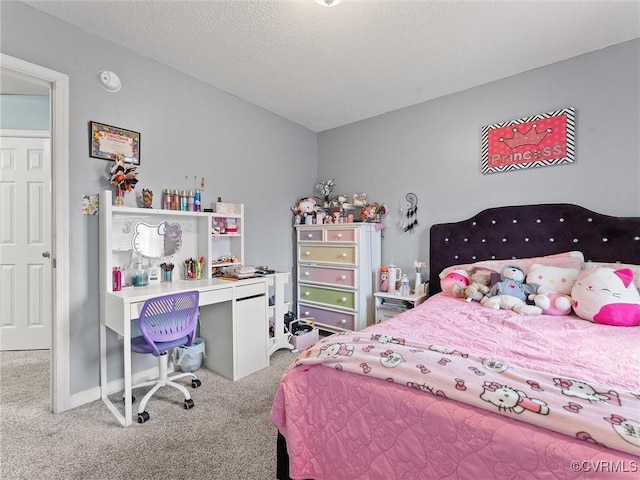 bedroom with carpet floors, baseboards, and a textured ceiling