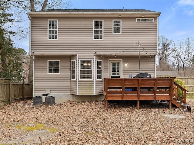 back of house featuring a fenced backyard, central AC, and a wooden deck