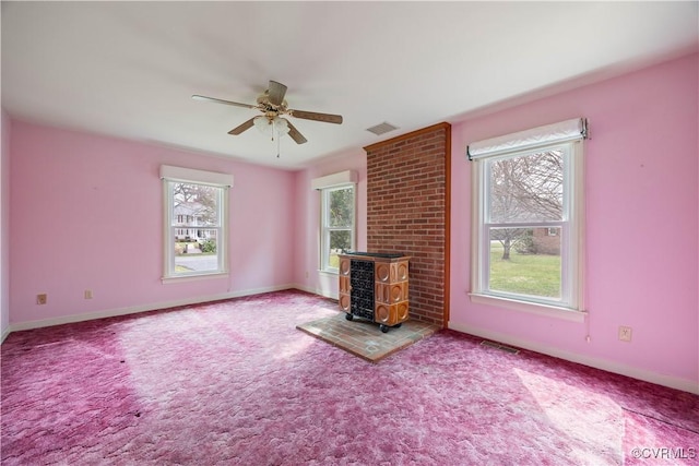 unfurnished living room featuring visible vents and baseboards