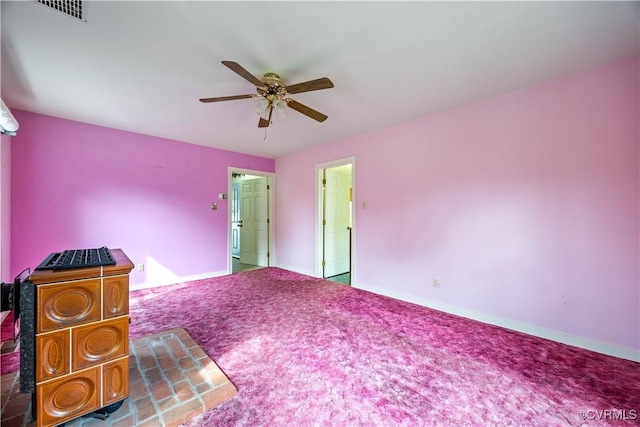 unfurnished bedroom featuring a ceiling fan and visible vents