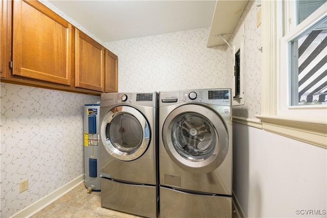 laundry room featuring wallpapered walls, baseboards, light tile patterned floors, washer and dryer, and cabinet space