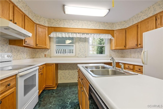 kitchen featuring wallpapered walls, under cabinet range hood, light countertops, white appliances, and a sink