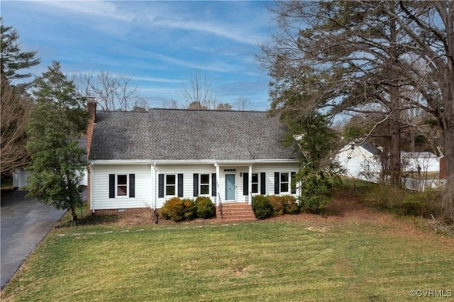 new england style home featuring a shingled roof, a chimney, a front lawn, crawl space, and aphalt driveway