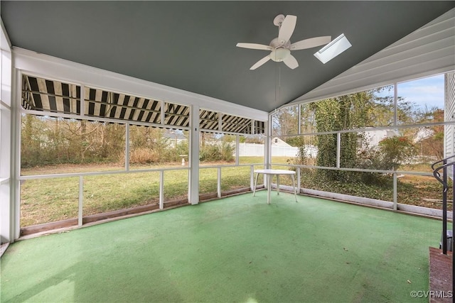 unfurnished sunroom with ceiling fan and vaulted ceiling