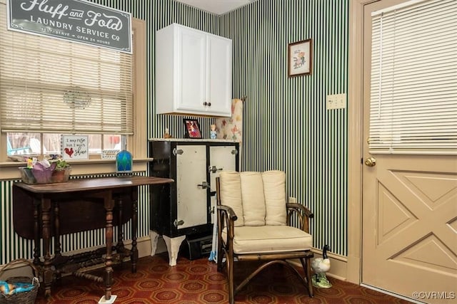 living area with wallpapered walls