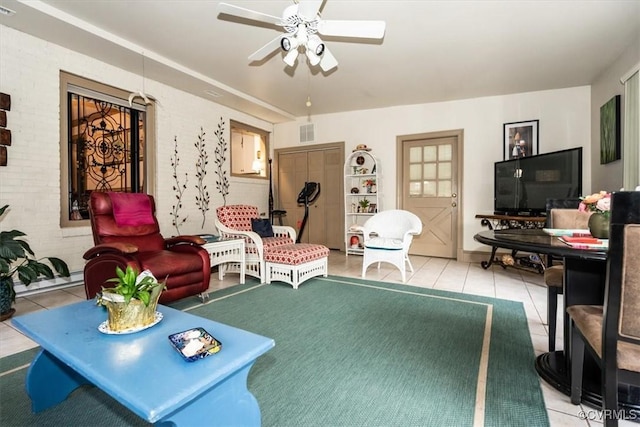 tiled living room with ceiling fan and visible vents