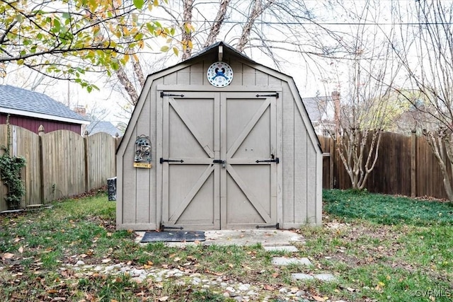 view of shed featuring a fenced backyard