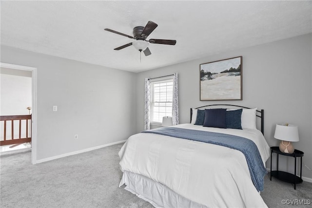 bedroom with carpet flooring, ceiling fan, and baseboards