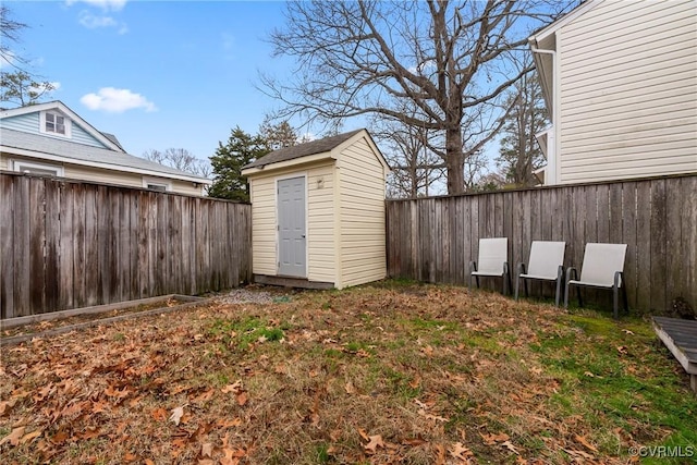 view of shed featuring a fenced backyard