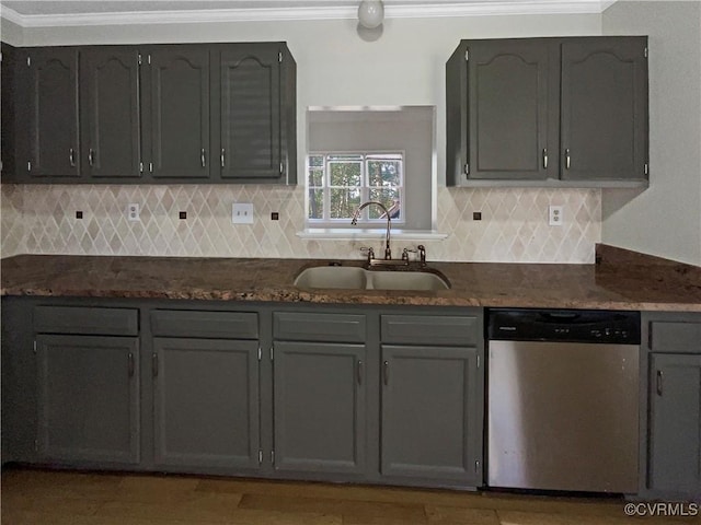 kitchen featuring a sink, tasteful backsplash, ornamental molding, and stainless steel dishwasher