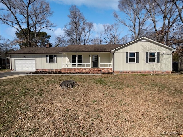 ranch-style house featuring an attached garage, driveway, crawl space, a chimney, and a front yard