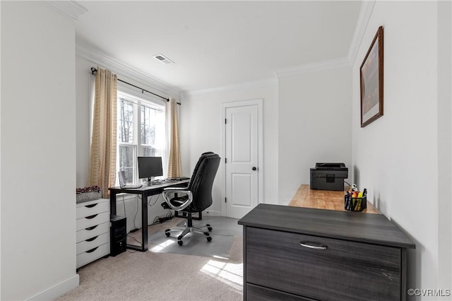 carpeted office with baseboards, visible vents, and crown molding