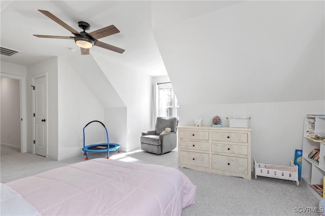 carpeted bedroom featuring lofted ceiling, baseboards, visible vents, and a ceiling fan