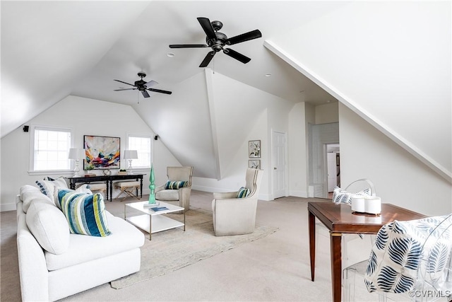 carpeted living area featuring lofted ceiling and baseboards